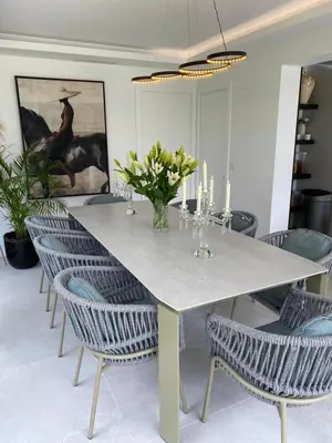 a dining room with a white table and chairs at Luxury Villa with Pool & Sea View-10 Minutes from Monaco in Èze