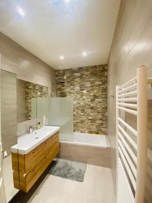 a bathroom with a tub and a sink and a bath tub at Promenade des Anglais /Carré d'or - 2 mins plages in Nice
