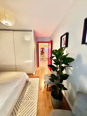 a room with a bed and a plant in it at Large magnificent terrace (40 sq.m) in Nice