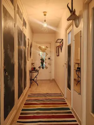 a hallway with a rug on the floor at Central Studio in Nice