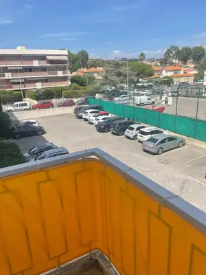 a group of cars parked in a parking lot at 3 pièces au cœur du cros de cagnes in Cagnes-sur-Mer