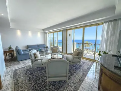 a living room with a view of the ocean at Panoramic Sea View Promenade in Nice