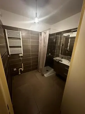 a bathroom with a shower and a sink and a mirror at Superbe Appartement terrasse 2P à 5 min à pied du vieux Nice, du port et du Tram in Nice