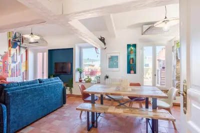 a living room with a blue couch and a table at #48 Suite Jean top floor terrace 5min walk sea AC in Nice