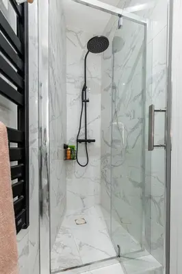 a bathroom with a shower with a glass door at MY CASA - FOCH - Superb Suite w AC Downtown in Nice