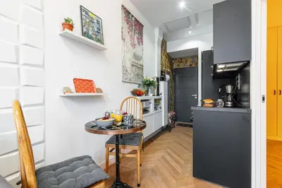a kitchen with a small table and a kitchen with a stove at MY CASA - FOCH - Superb Suite w AC Downtown in Nice