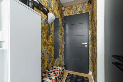 a hallway with a black door and colorful wallpaper at MY CASA - FOCH - Superb Suite w AC Downtown in Nice