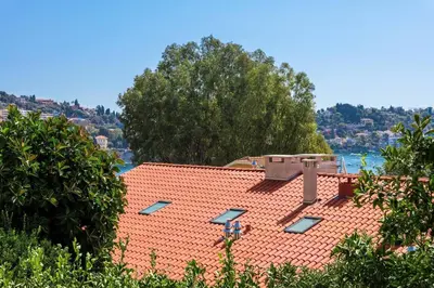 a red roof with solar panels on top of it at Charmant 3 pièces vue mer in Villefranche-sur-Mer