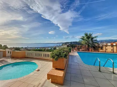 a swimming pool on the roof of a house at Nestor&Jeeves - HUBLOT TERRASSE - Sea view - swimming pool in Nice