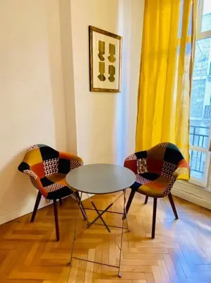 two chairs and a table in a room at Coeur de Nice emplacement idéal in Nice
