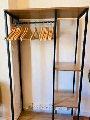 a cabinet filled with lots of wooden utensils at Coeur de Nice emplacement idéal in Nice