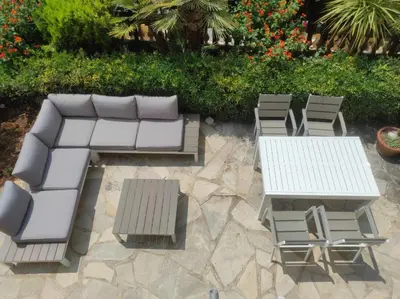 a group of white tables and chairs on a patio at Mont Boron Exclusive Apartment in Villa Belle Époque in Nice