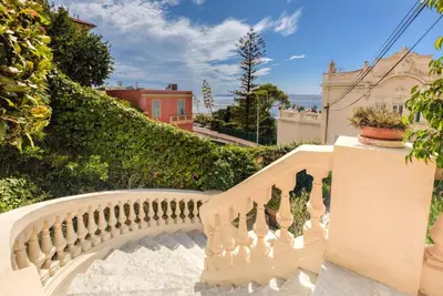 a staircase leading up to a house with plants at Mont Boron Exclusive Apartment in Villa Belle Époque in Nice