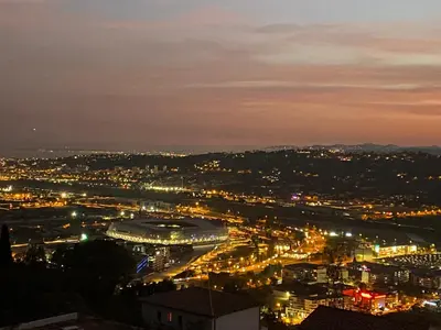 a view of a city at night with lights at Logement privé Nice - Crémat in Nice