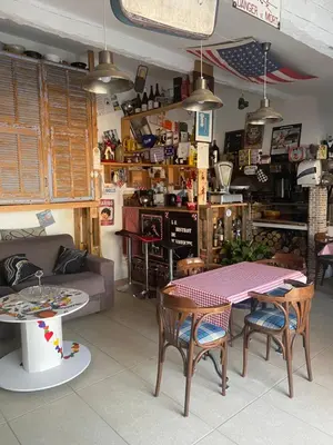 a living room with a table and a couch at Logement privé Nice - Crémat in Nice