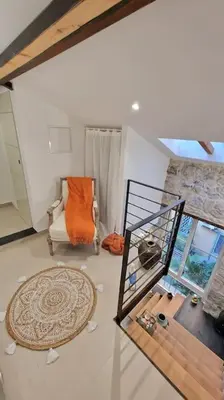 an aerial view of a living room with a chair at T3 duplex cosy & calme au port - Tram in Nice