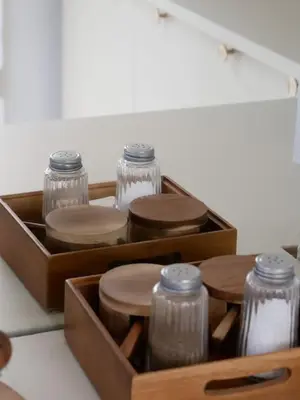 a wooden box with four glass jars in it at LOVELY STUDIO - Port de Nice in Nice