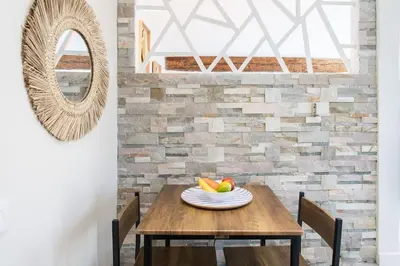 a dining room table with a bowl of fruit on it at #49 Perfect location Saleya old town 2mins to Sea AC in Nice