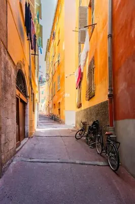 two bikes parked on a street between two buildings at #49 Perfect location Saleya old town 2mins to Sea AC in Nice