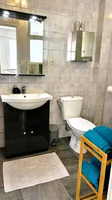 a bathroom with a white toilet and a sink at Studio calme Nice hyper centre in Nice