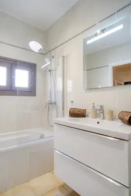 a living room with a couch and a table at Cosy, modern, fully equipped, air conditioning, Nice historical, old town, 1minute walk from beach - 