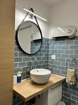 a bathroom with a sink and a mirror at Studio HYPER CENTRE in Nice