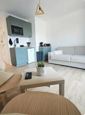 a kitchen with a sink and a microwave at Studio Saint-Laurent-Du-Var bord de mer in Saint-Laurent-du-Var