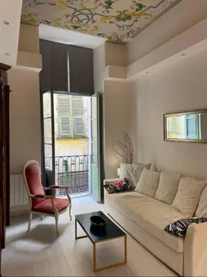 a living room with a couch and a chair at Luxury apartment In the heart of old town Nice. in Nice