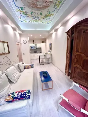 a living room with a couch and a coffered ceiling at Luxury apartment In the heart of old town Nice. in Nice