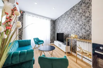 a living room with a couch and a tv at Nice Renting - OFFENBACH - Luxury Apartment Fully Equipped Center in Nice