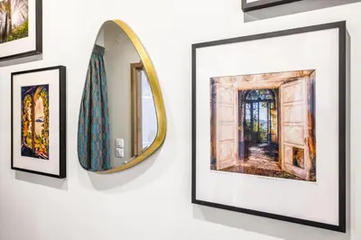 a framed picture of a door and a mirror on a wall at Nice Renting - OFFENBACH - Luxury Apartment Fully Equipped Center in Nice