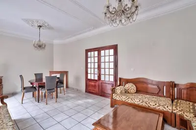 a living room with a couch and a table at Nidusudest - Spacieux appartement in Nice
