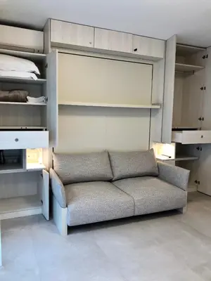 a couch in a room with a bed at Studios Nice Gambetta in Nice
