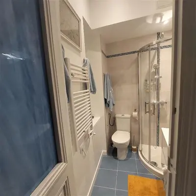 a small bathroom with a toilet and a shower at MAO in Nice