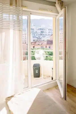 a large window with a view of a city at Studio cozy et moderne dans résidence à Nice in Nice