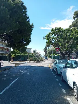 two cars parked on the side of a street at Studio de 14m2 dans une maison in Cagnes-sur-Mer