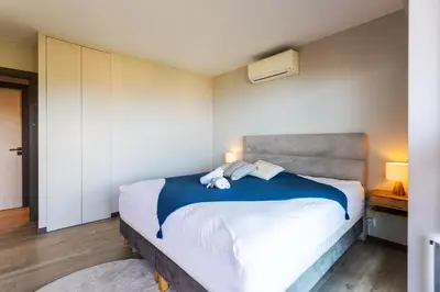 a bedroom with a bed with two teddy bears on it at BELLES TERRES AP4378 By Riviera Holiday Homes in Nice
