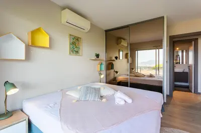 a bedroom with a large bed in a room at BELLES TERRES AP4378 By Riviera Holiday Homes in Nice