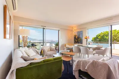 a living room with a couch and chairs and a table at BELLES TERRES AP4378 By Riviera Holiday Homes in Nice