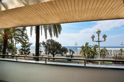 a view of the beach from a window at Incroyable vue mer, 2 pièces refait à neuf avec piscine sur le toit/ WIFI/AC in Nice