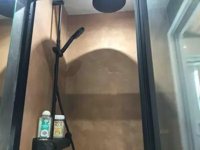 a bathroom shower with a blow dryer and a mirror at Studio de charme au coeur de la vieille ville in Nice