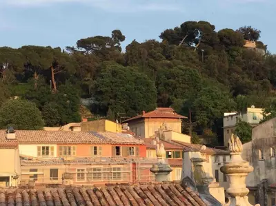 a group of buildings in front of a mountain at Studio de charme au coeur de la vieille ville in Nice