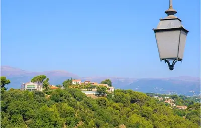 a street light on top of a hill at Awesome Apartment In Cagnes-Sur-Mer in Cagnes-sur-Mer