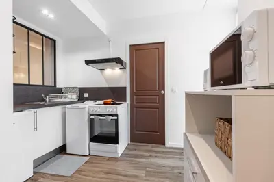 a kitchen with a stove and a sink at MY CASA - MARI 71 - Unique Apt Near Sea in Nice