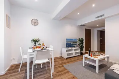 a white living room with a white table and chairs at MY CASA - MARI 71 - Unique Apt Near Sea in Nice