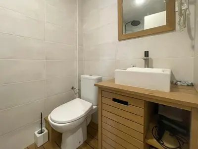 a bathroom with a white toilet and a sink at Saint Francois de Paul - wifi, AC, 6 pers in Nice