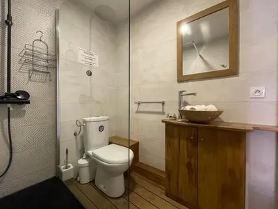 a bathroom with a toilet and a sink at Saint Francois de Paul - wifi, AC, 6 pers in Nice