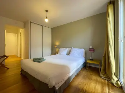 a bedroom with a large white bed and a window at Saint Francois de Paul - wifi, AC, 6 pers in Nice
