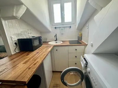 a small kitchen with a sink and a microwave at Beau studio au cœur de Nice in Nice