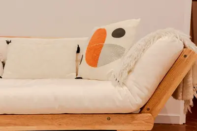a white couch with a fan on the wall at Old Town Nice Place Rossetti Themed 2BR Apartment Full Air Conditioning in Nice